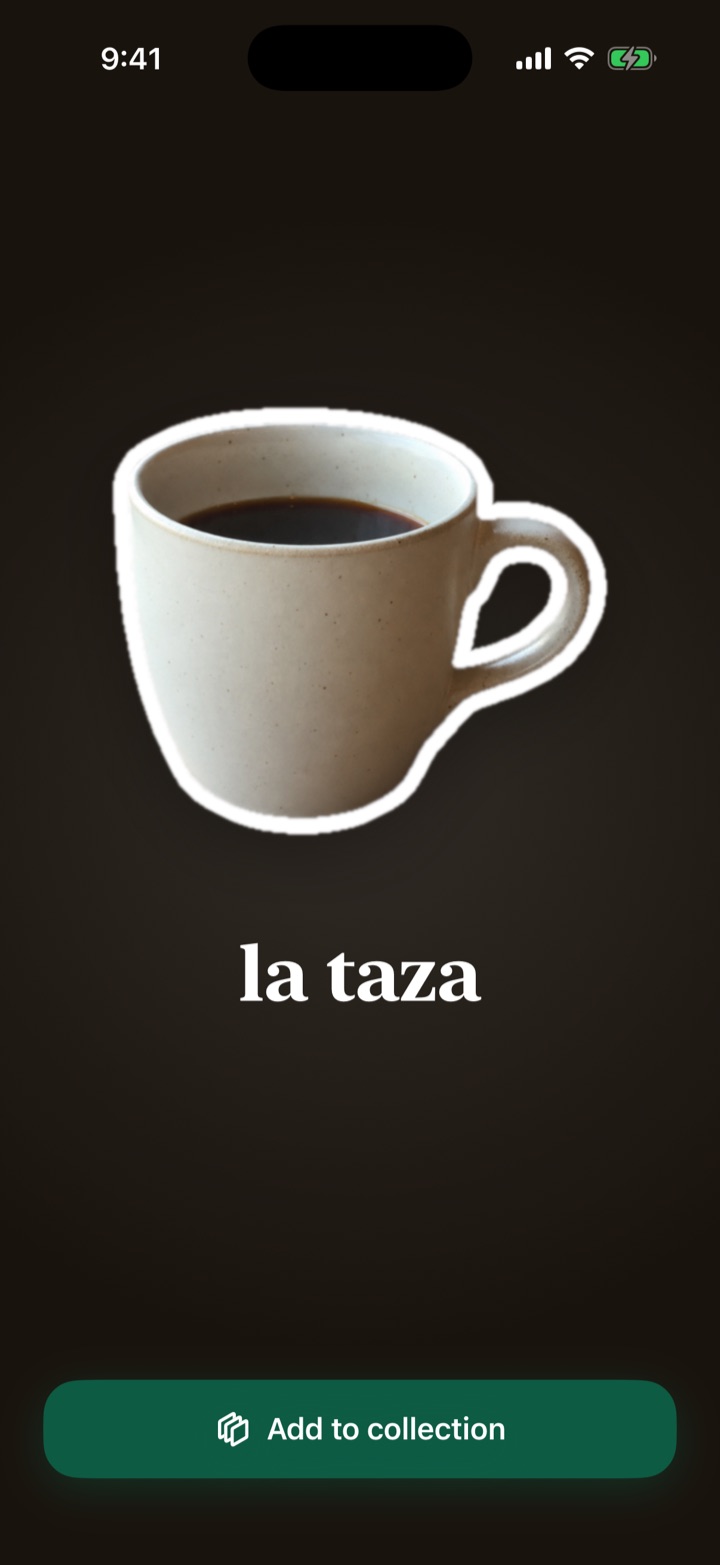 A just-caught coffee cup revealed as a sticker with its Spanish name, la taza.
